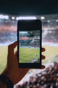 taking a photo 200x300 - How to Attend the UEFA Euro 2020 - Tips and Tricks for Watching the Upcoming European Championship Live