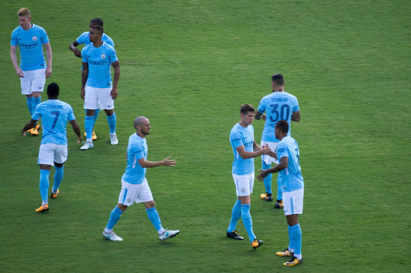 Manchester City players on the pitch 